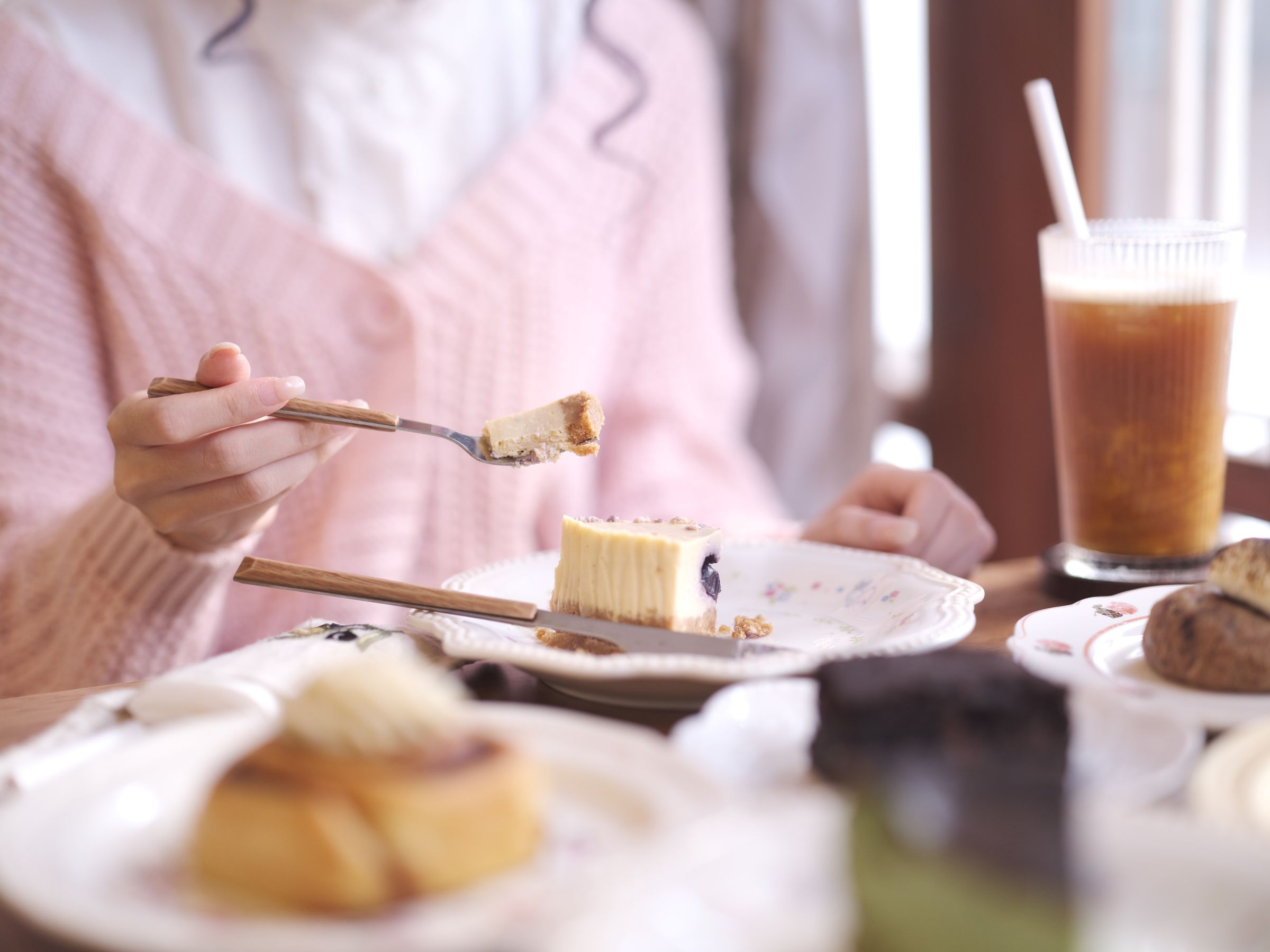 Cake and iced coffee in the window seat