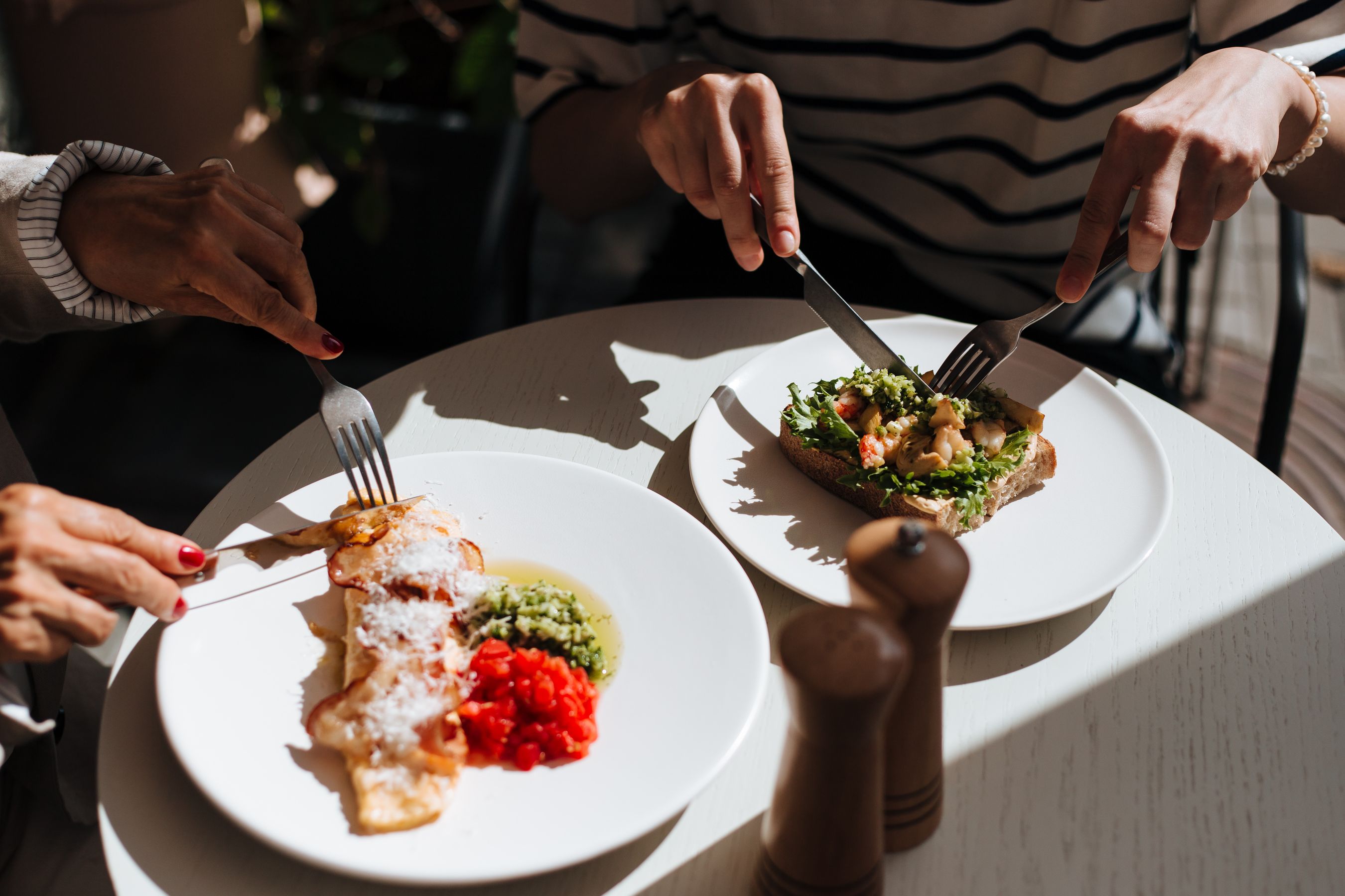Friends sharing brunch at a table inside the cafe